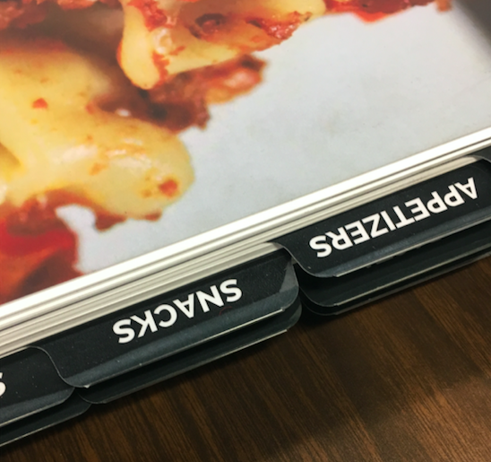 "Appetizers" and "Snacks" black tabs in a cookbook