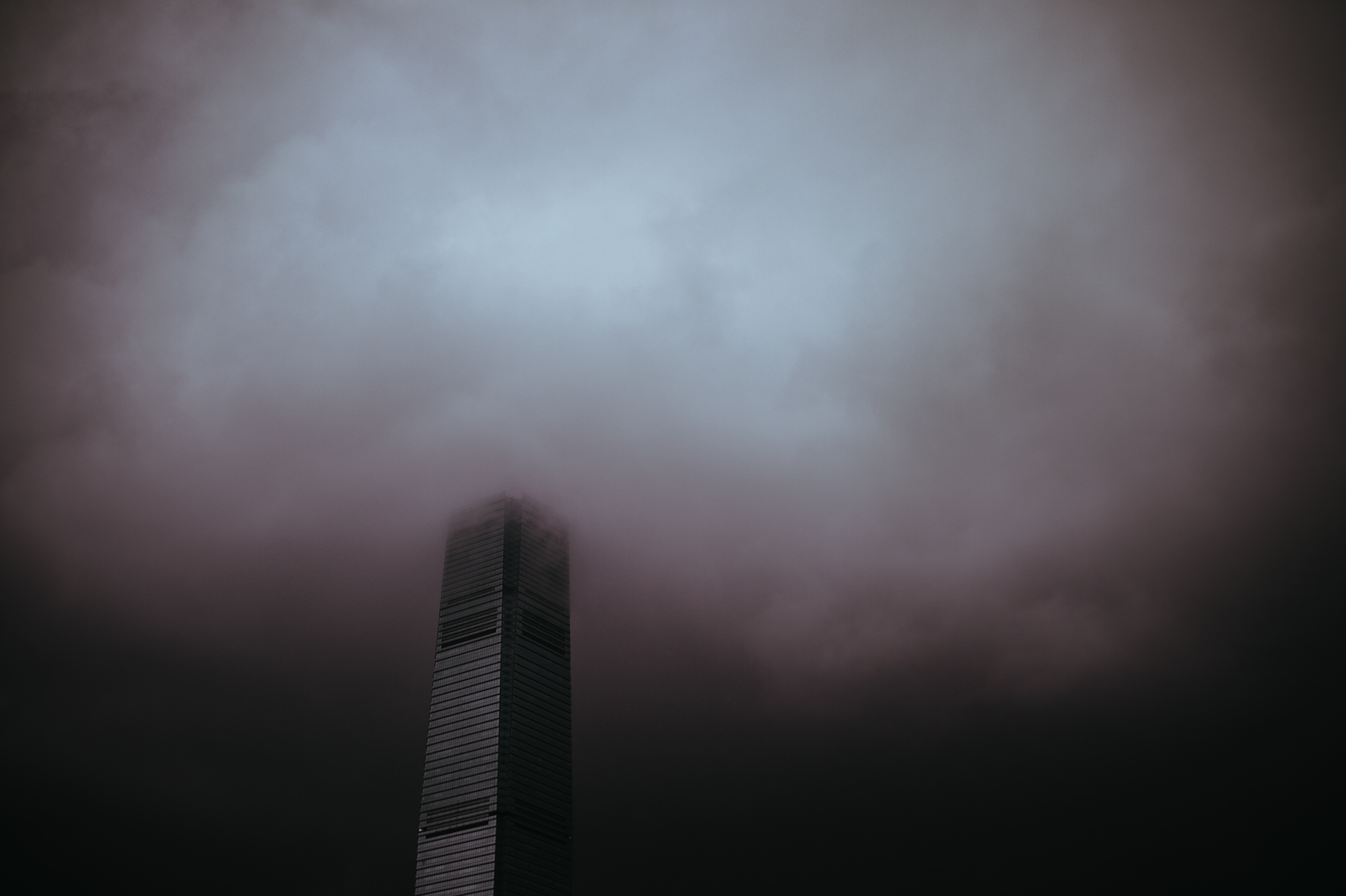 Skyscraper in a dark, foggy sky 