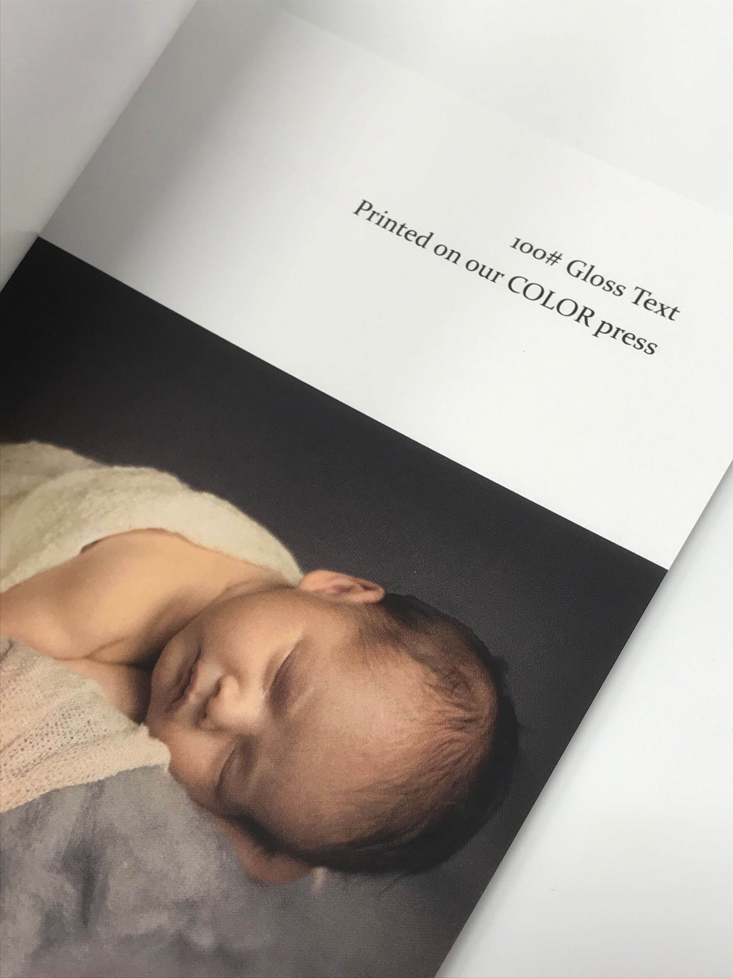 100# Gloss Text paper with printed photo of baby 