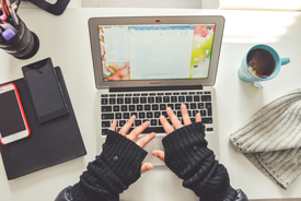 Birds eye view of person typing on laptop