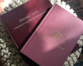 Leather & cloth books on ottoman