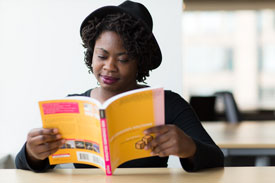 woman sitting reading a book